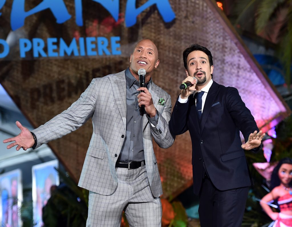 My Magical Experience on Disney's Moana Red Carpet HOLLYWOOD, CA - NOVEMBER 14: Actor Dwayne Johnson (L) and songwriter Lin-Manuel Miranda perform onstage at The World Premiere of Disneys "MOANA" at the El Capitan Theatre on Monday, November 14, 2016 in Hollywood, CA. (Photo by Alberto E. Rodriguez/Getty Images for Disney) *** Local Caption *** Lin-Manuel Miranda; Dwayne Johnson