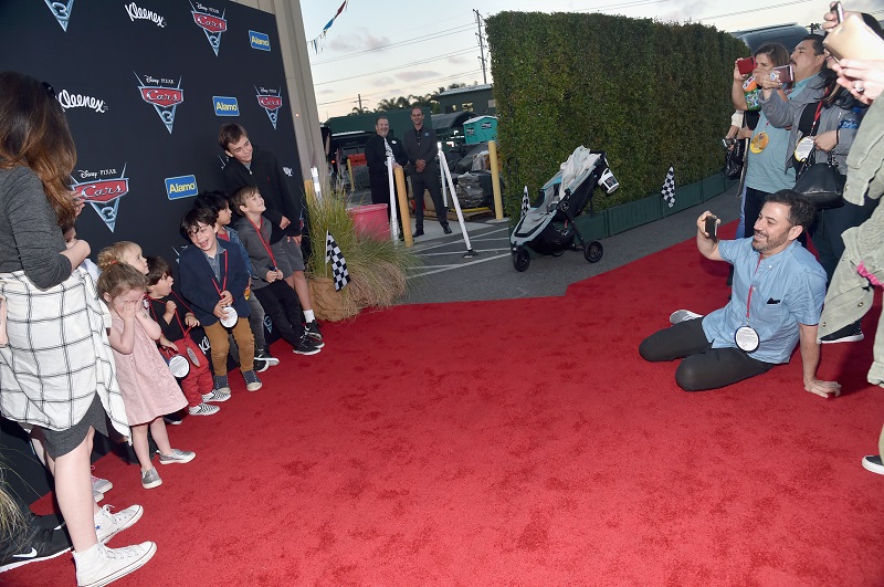 ANAHEIM, CA - JUNE 10: TV personality Jimmy Kimmel (R, seated) takes a picture of guests at the after party for the World Premiere of Disney/Pixars Cars 3 at Cars Land at Disney California Adventure in Anaheim, CA. (Photo by Alberto E. Rodriguez/Getty Images for Disney) *** Local Caption *** Jimmy Kimmel